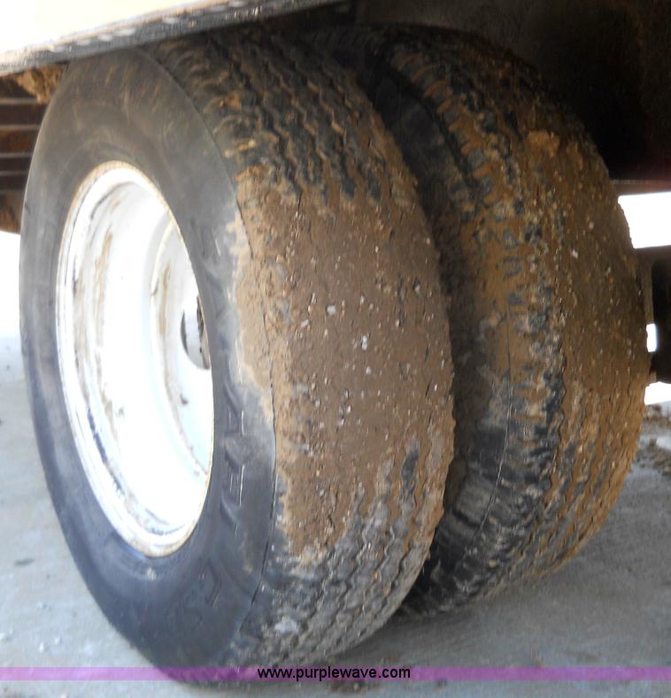 image for item 7768 1998 Dynaweld 30' flatbed trailer with dove-tail ramps