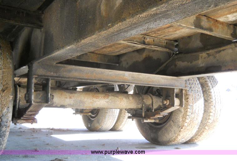 image for item 7768 1998 Dynaweld 30' flatbed trailer with dove-tail ramps