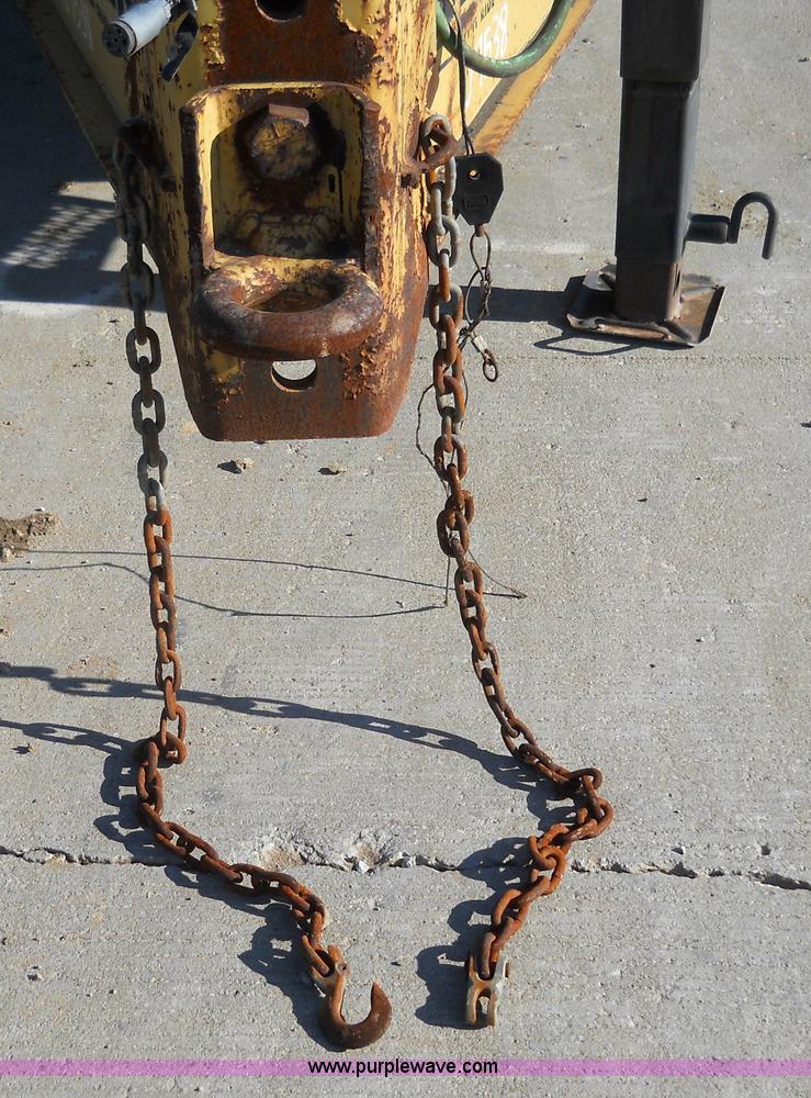 image for item 7768 1998 Dynaweld 30' flatbed trailer with dove-tail ramps