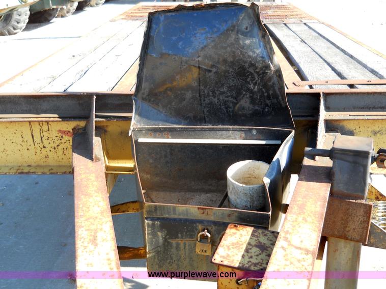 image for item 7768 1998 Dynaweld 30' flatbed trailer with dove-tail ramps