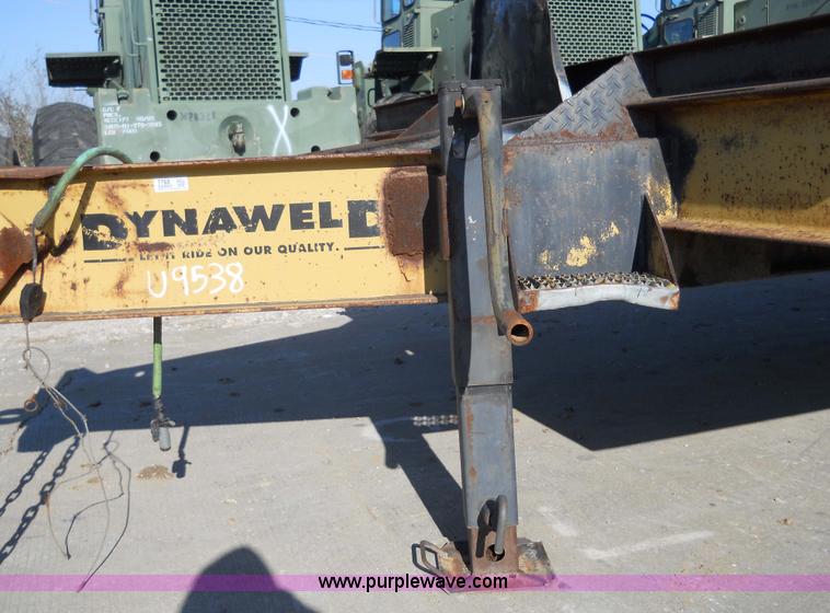 image for item 7768 1998 Dynaweld 30' flatbed trailer with dove-tail ramps