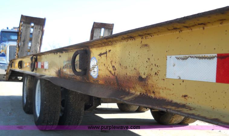 image for item 7768 1998 Dynaweld 30' flatbed trailer with dove-tail ramps