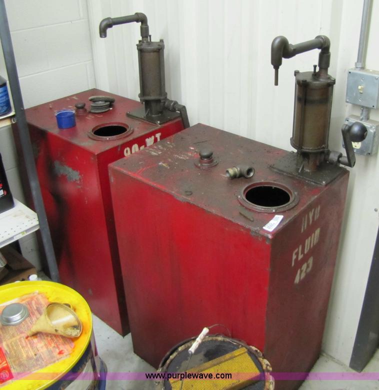 image for item 5233 (3) liquid storage tanks with hand pumps