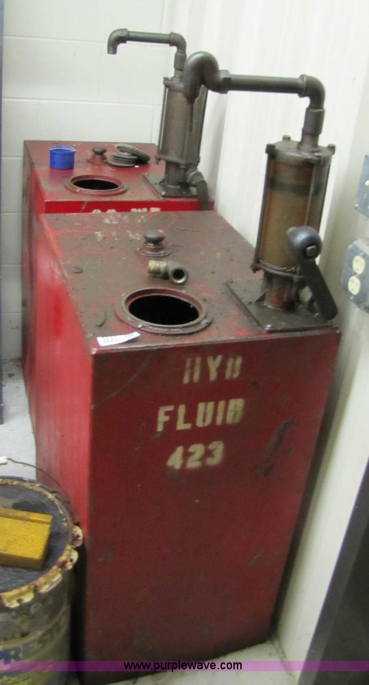 image for item 5233 (3) liquid storage tanks with hand pumps