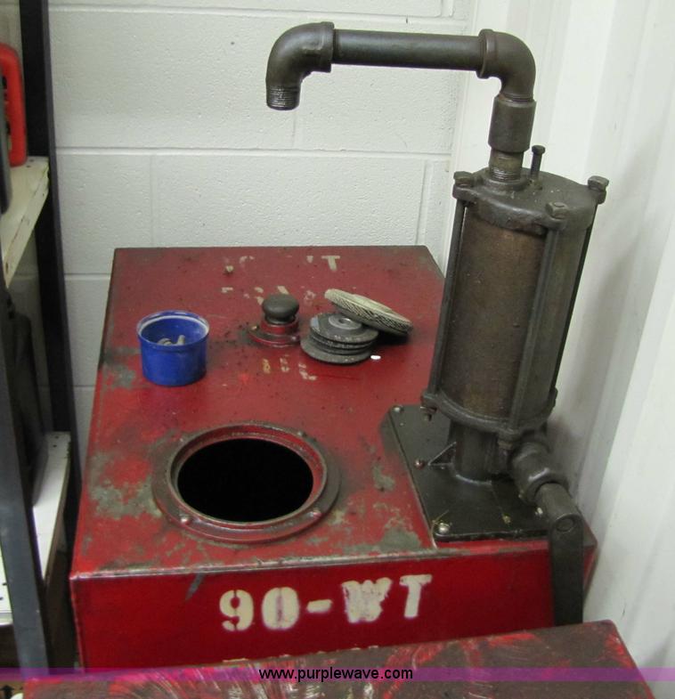 image for item 5233 (3) liquid storage tanks with hand pumps