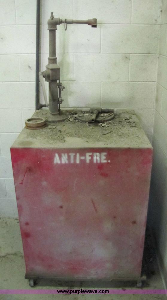 image for item 5233 (3) liquid storage tanks with hand pumps