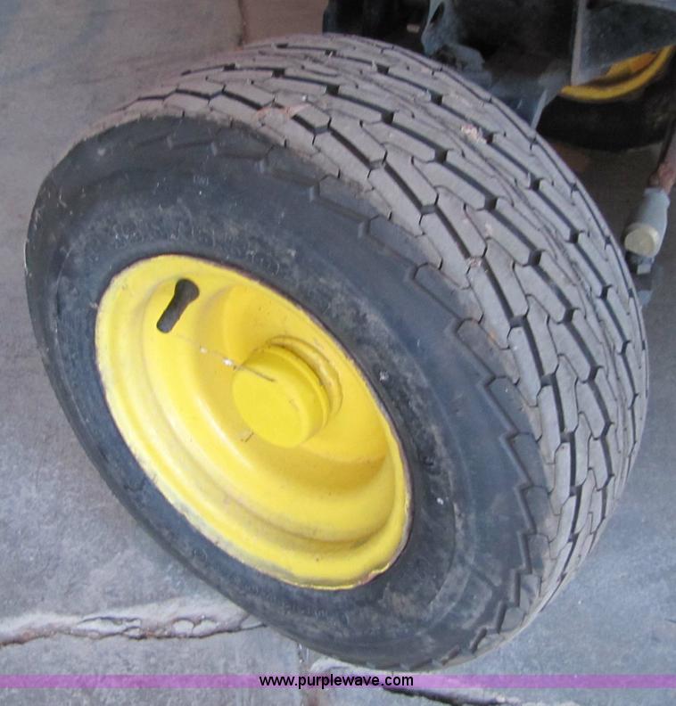 image for item 5235 1994 John Deere F925 front mount mower with broom