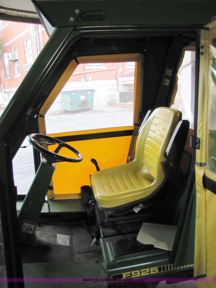 image for item 5235 1994 John Deere F925 front mount mower with broom