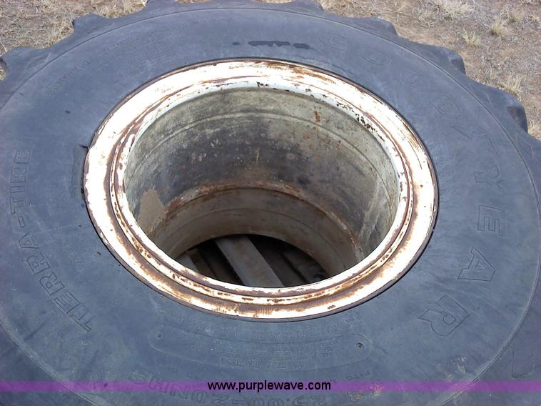 image for item 1828 (2) Goodyear 48x25.00-20NHS Terra tires and rims