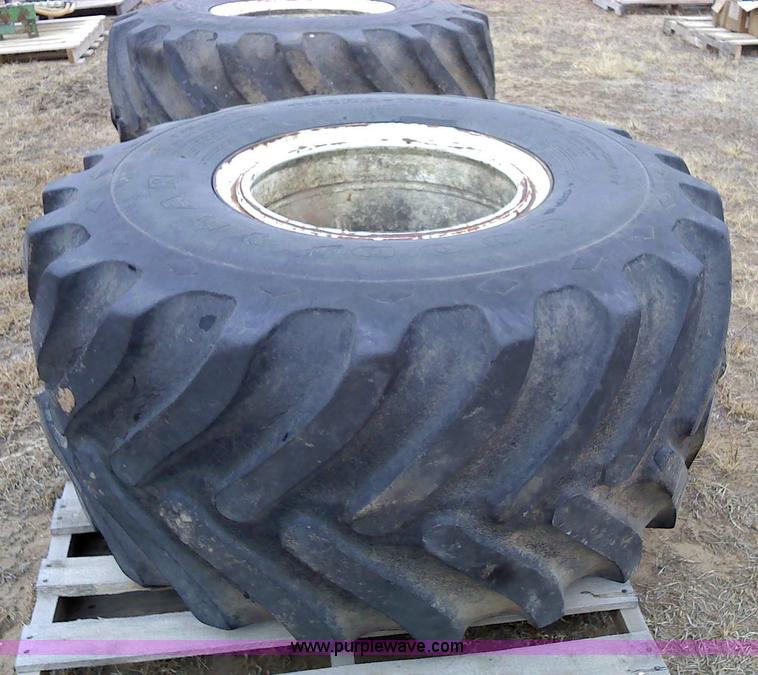 image for item 1828 (2) Goodyear 48x25.00-20NHS Terra tires and rims
