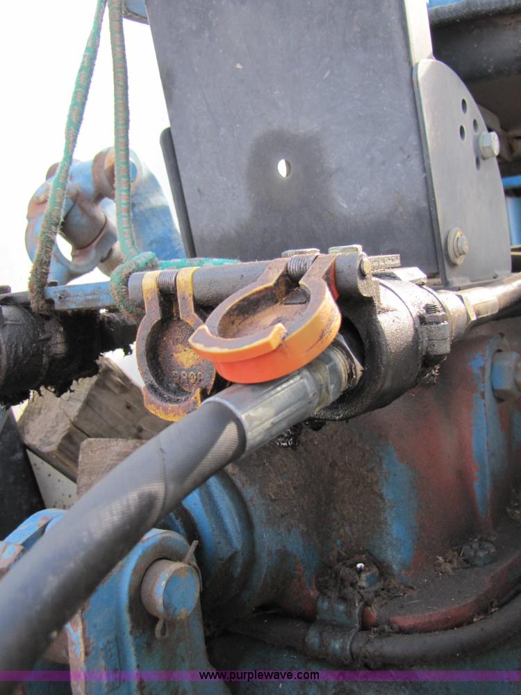 image for item 3515 John Deere 702 10 wheel rake