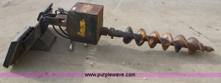 image for item 4959 Lowe 1200 hydraulic post hole digger skid steer attachment