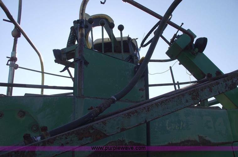 image for item 5512 John Deere 734 high cycle sprayer