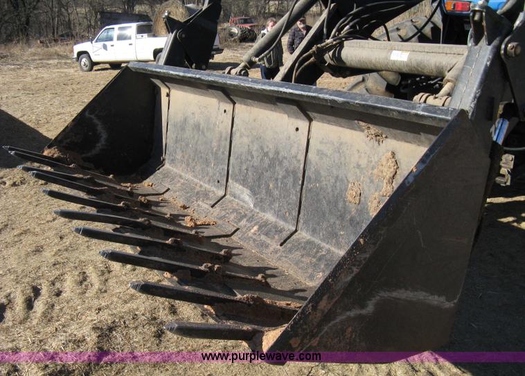 image for item 8105 1999 New Holland TV140 bi-directional tractor