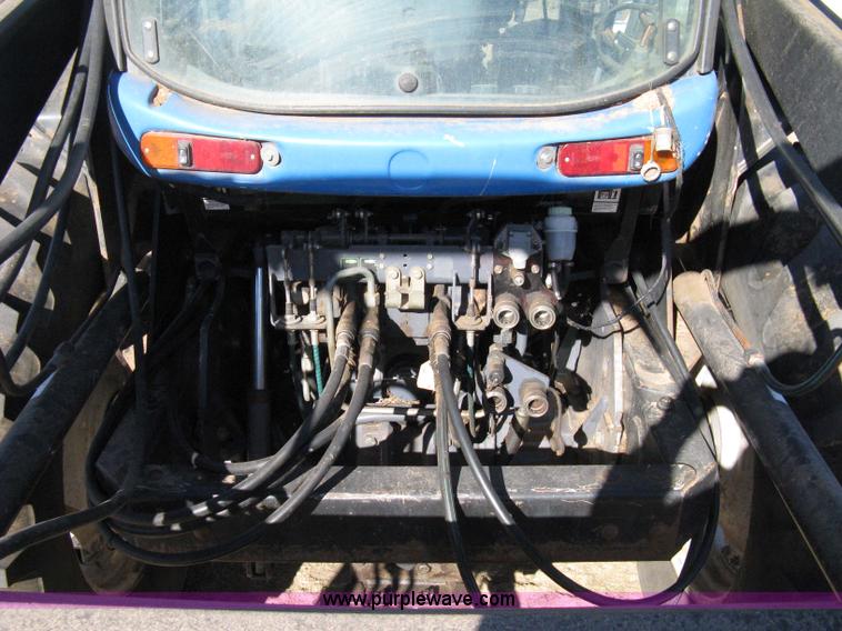 image for item 8105 1999 New Holland TV140 bi-directional tractor