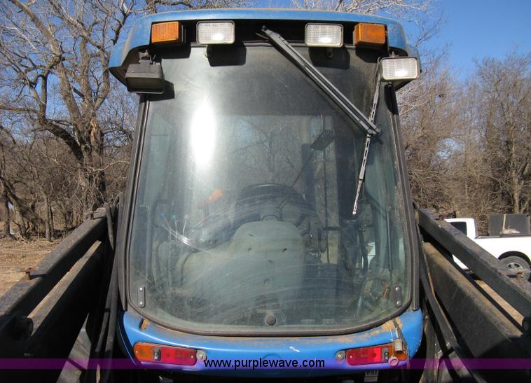 image for item 8105 1999 New Holland TV140 bi-directional tractor