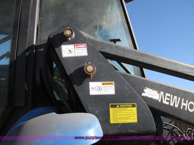 image for item 8105 1999 New Holland TV140 bi-directional tractor