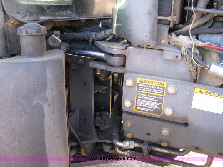 image for item 8105 1999 New Holland TV140 bi-directional tractor