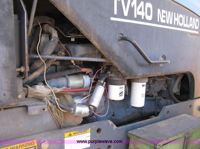 image for item 8105 1999 New Holland TV140 bi-directional tractor