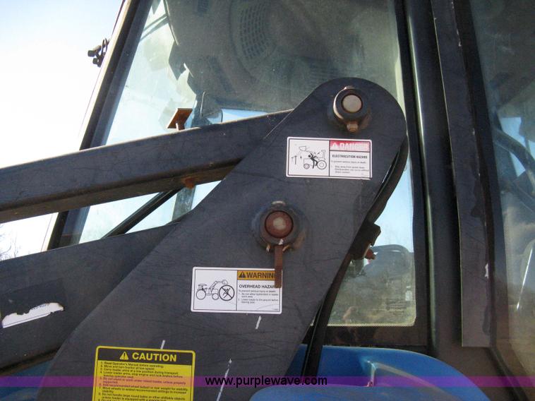 image for item 8105 1999 New Holland TV140 bi-directional tractor