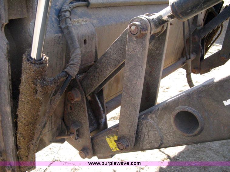 image for item 8105 1999 New Holland TV140 bi-directional tractor