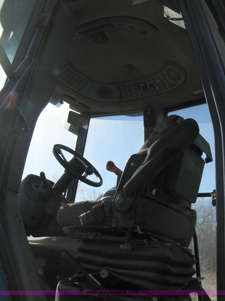 image for item 8105 1999 New Holland TV140 bi-directional tractor