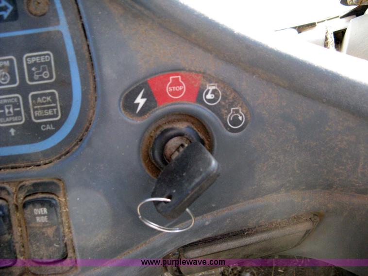 image for item 8105 1999 New Holland TV140 bi-directional tractor