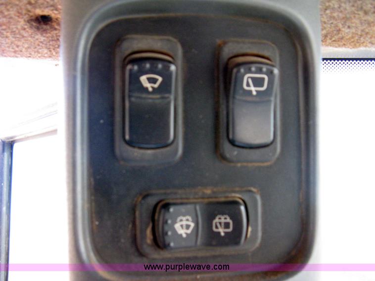 image for item 8105 1999 New Holland TV140 bi-directional tractor