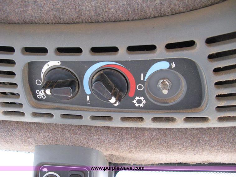 image for item 8105 1999 New Holland TV140 bi-directional tractor