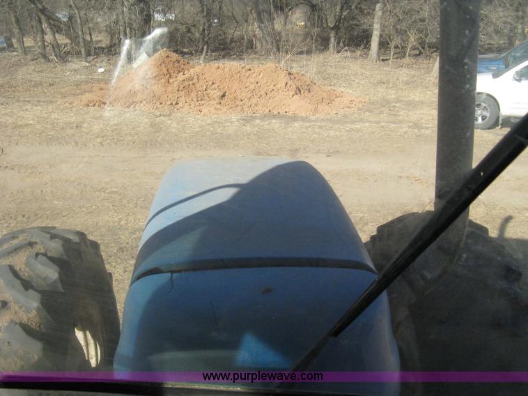 image for item 8105 1999 New Holland TV140 bi-directional tractor