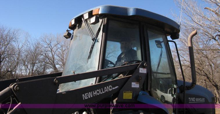 image for item 8105 1999 New Holland TV140 bi-directional tractor