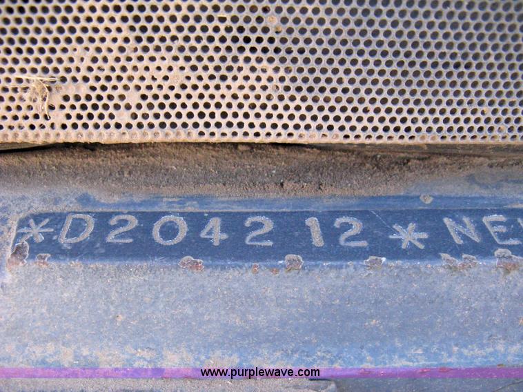 image for item 8105 1999 New Holland TV140 bi-directional tractor