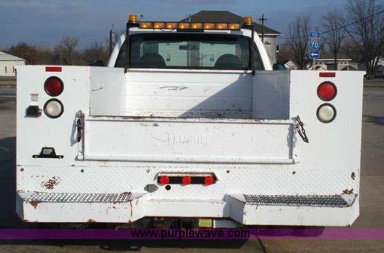 image for item 1005 2000 Ford F-350 Super Duty extended cab pickup truck with 8' service body
