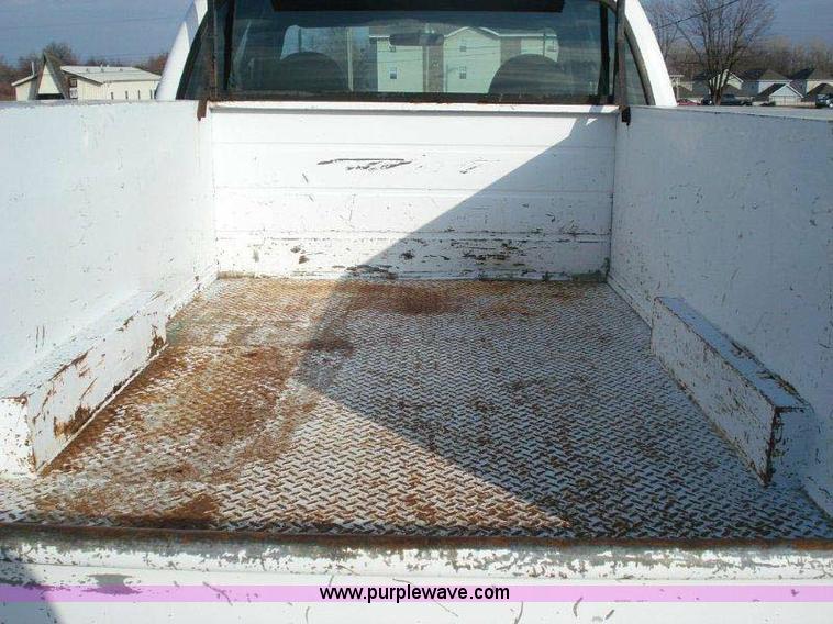 image for item 1005 2000 Ford F-350 Super Duty extended cab pickup truck with 8' service body