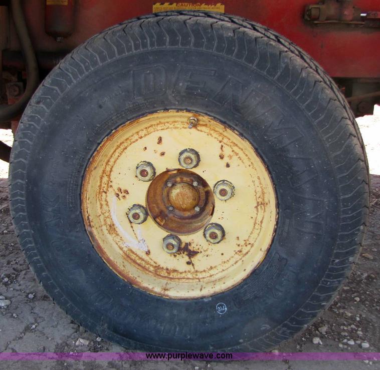 image for item 8346 New Holland 1049 stack cruiser