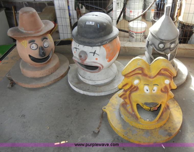 image for item 2100 (4) assorted cast iron trash can lids