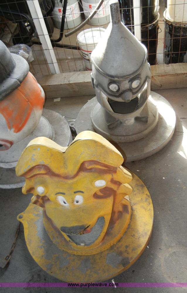 image for item 2100 (4) assorted cast iron trash can lids