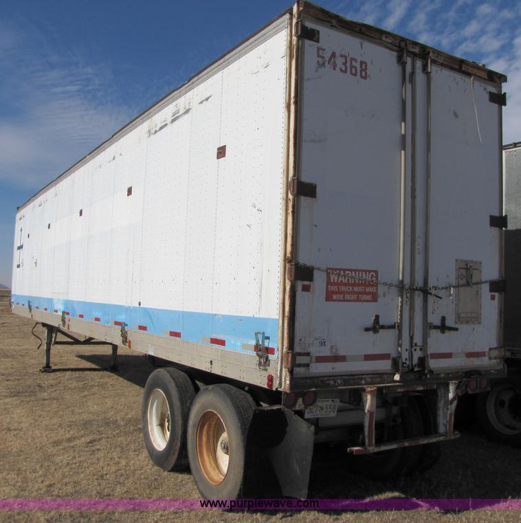 image for item 3567 1981 Fruehauf open top van trailer with tarp