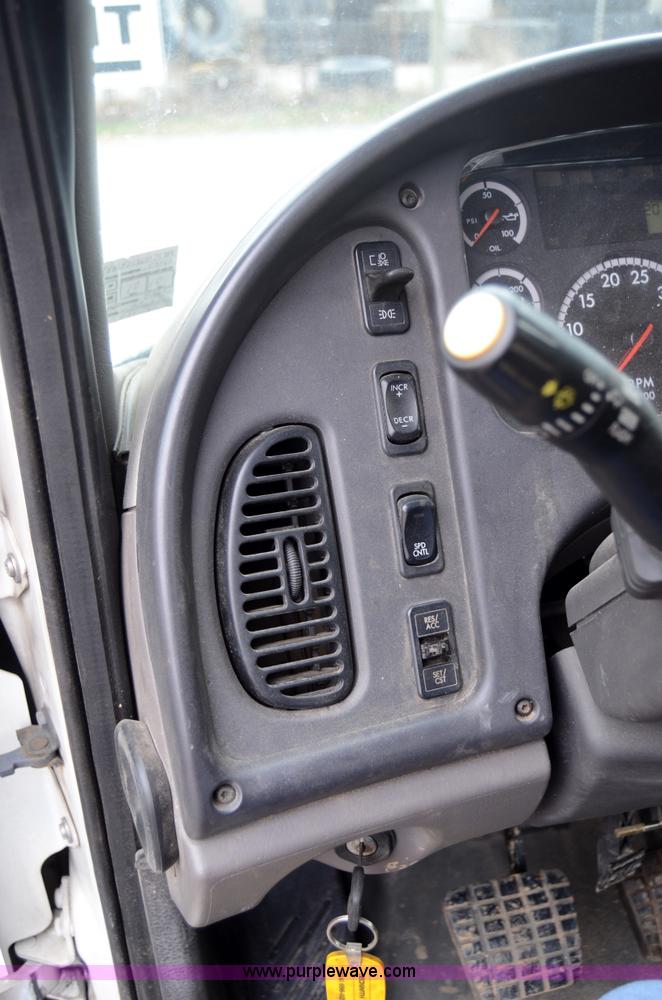 image for item 6041 2006 Freightliner M2 106 medium duty rollback truck