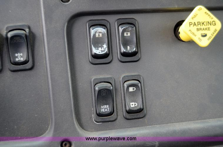 image for item 6041 2006 Freightliner M2 106 medium duty rollback truck