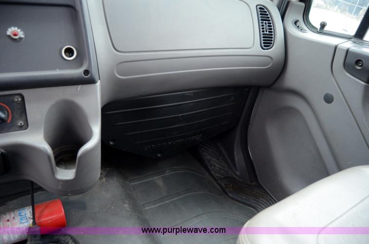 image for item 6041 2006 Freightliner M2 106 medium duty rollback truck