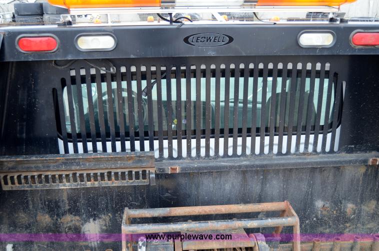 image for item 6041 2006 Freightliner M2 106 medium duty rollback truck