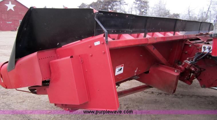 image for item 3200 1989 Case 1083 eight row corn head