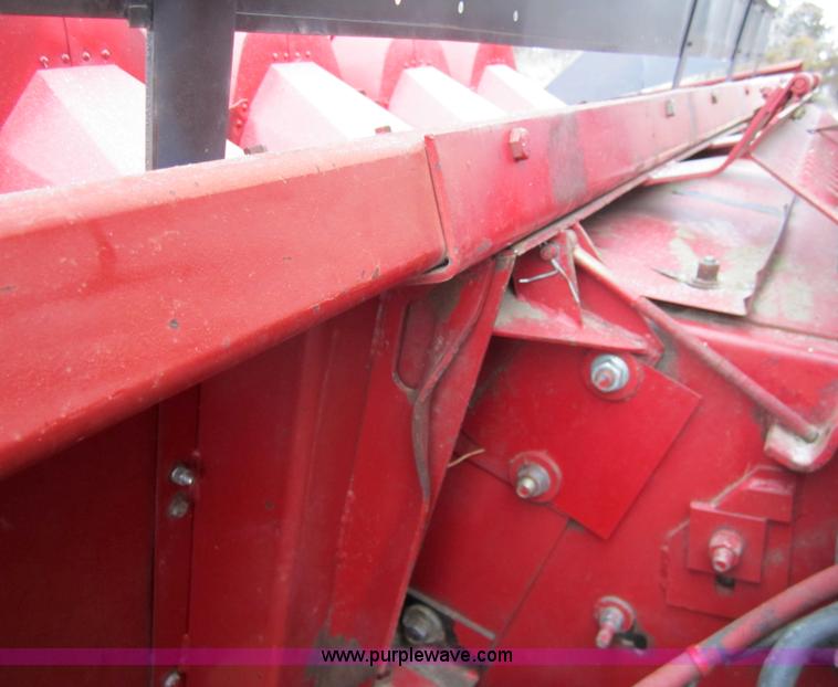 image for item 3200 1989 Case 1083 eight row corn head