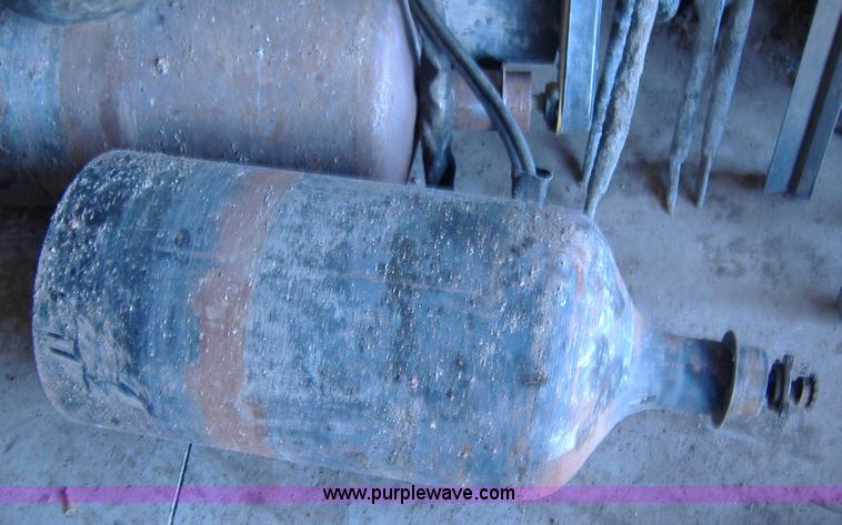 image for item 1502 2009 hydraulic curb machine attachment for skid loader