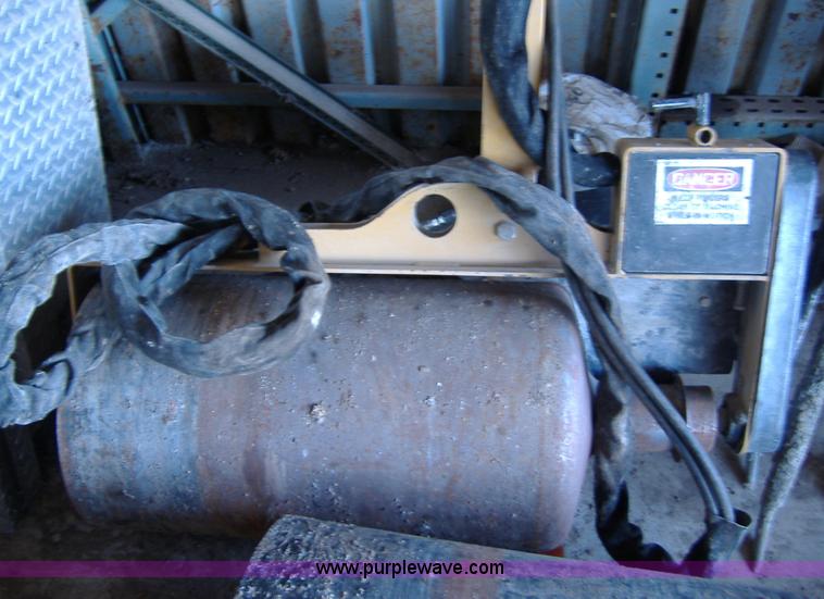 image for item 1502 2009 hydraulic curb machine attachment for skid loader