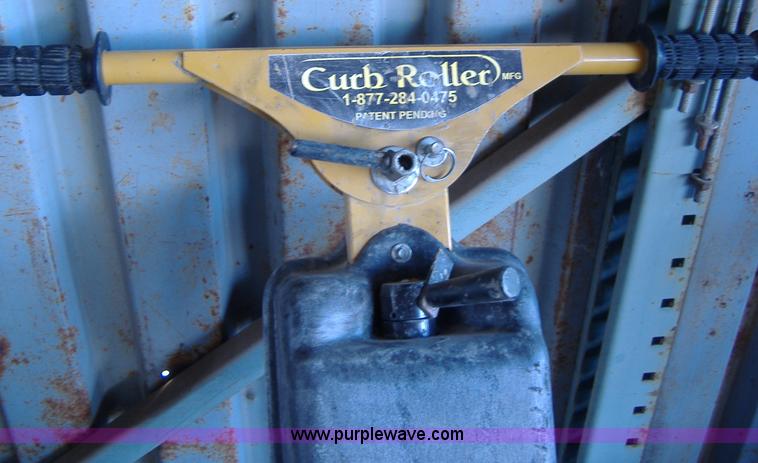 image for item 1502 2009 hydraulic curb machine attachment for skid loader