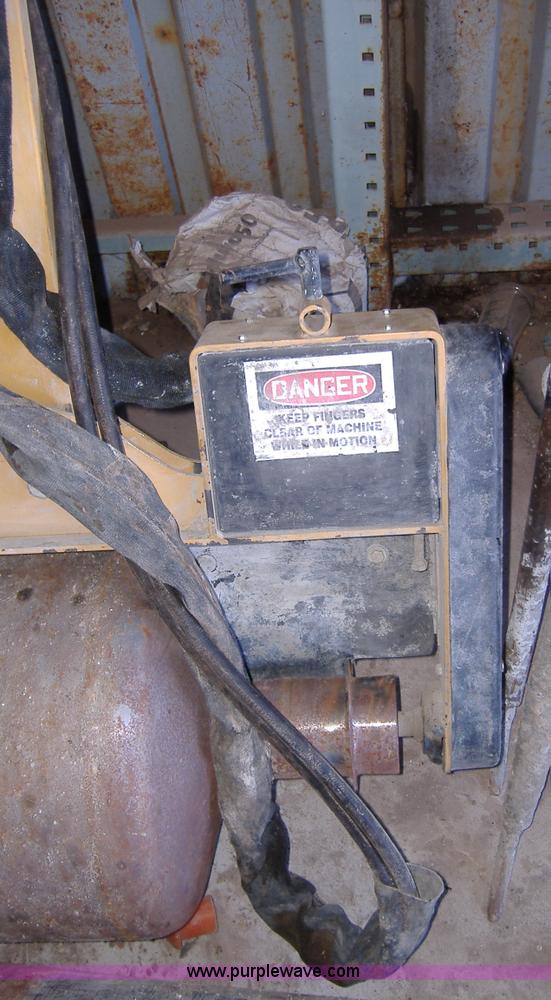 image for item 1502 2009 hydraulic curb machine attachment for skid loader