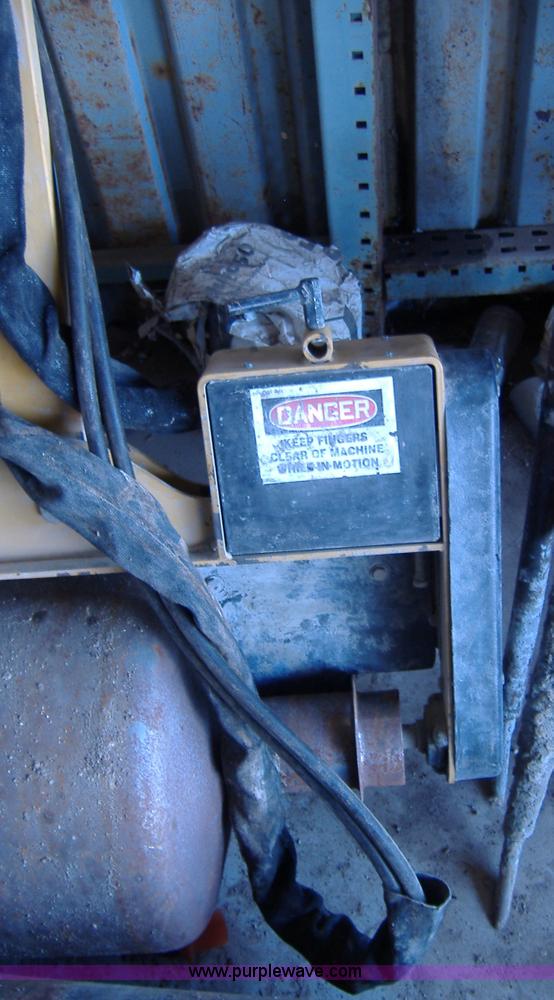 image for item 1502 2009 hydraulic curb machine attachment for skid loader