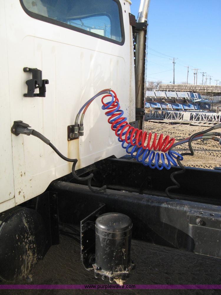 image for item 8149 1995 International 4700 single axle semi truck